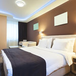 modern hotel room with a queen bed and stylish decor