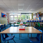 bright classroom with desks and chairs