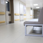 hospital corridor with empty bench and clean floor