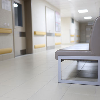 hospital hallway with empty bench