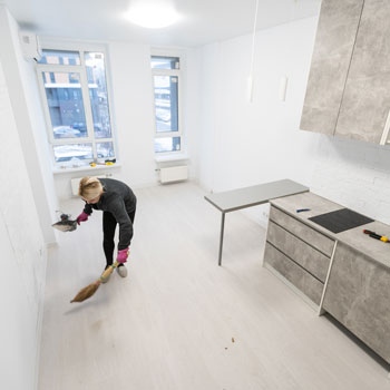 woman cleaning a newly renovated room